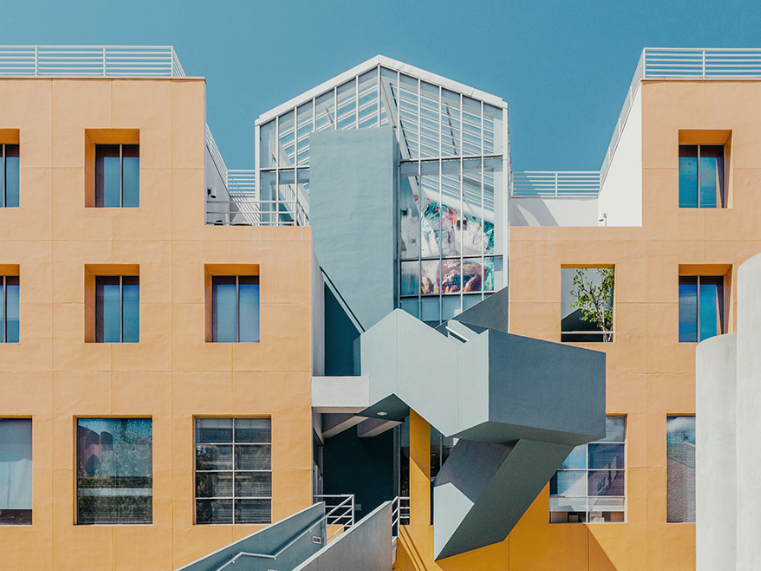 Blue and orange asymmetric postmodern building staircase